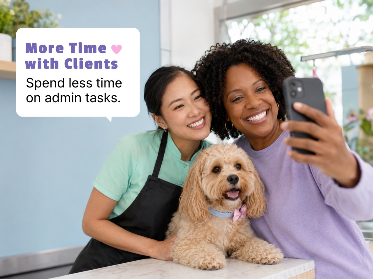 Pet groomer taking a selfie with a dog